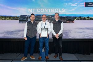 Osman Coban, employee of Move & Traffic Controls at MAN in Turkey, with two colleagues